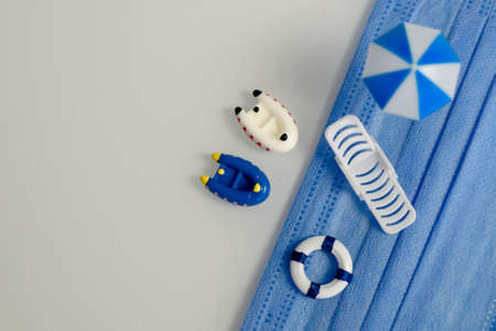 miniatures about relaxing on the beach and protection from viral and bacterial infection on vacation