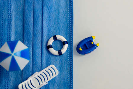 miniatures about relaxing on the beach and protection from viral and bacterial infection on vacationの写真素材