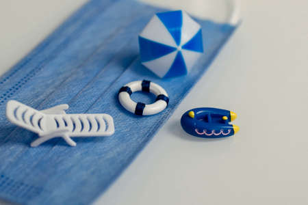 miniatures about relaxing on the beach and protection from viral and bacterial infection on vacationの写真素材