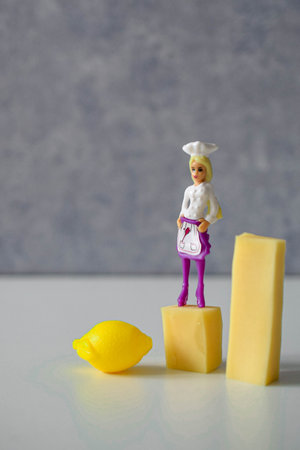 miniature cook doll in game situations with a car and plantsの写真素材