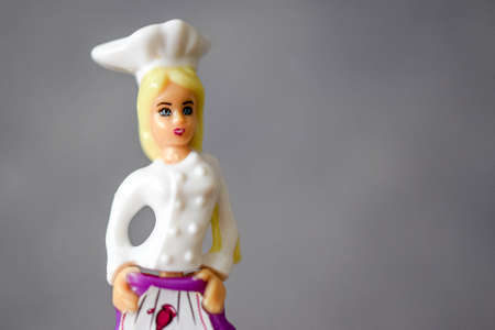 miniature cook doll in game situations with a car and plantsの写真素材