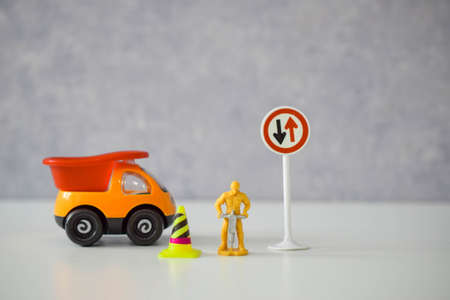 road worker or worker with a jackhammer in various situations on the road, dolls