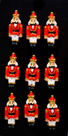 miniature soldiers in red uniforms