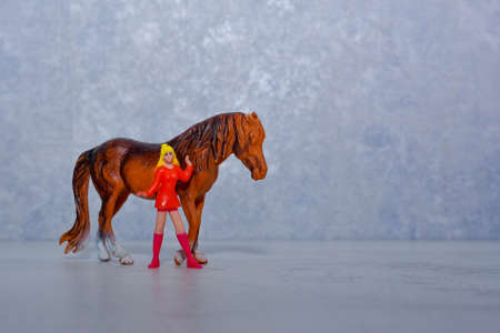 toy girl and toy horseの写真素材