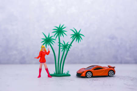 girl in bright clothes with a guitar near the wallの写真素材