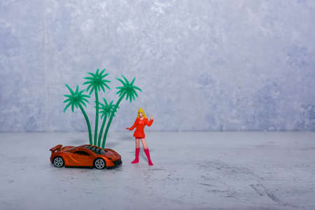 girl in bright clothes with a guitar near the wallの写真素材