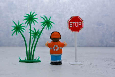 road worker or builder nearby with road signsの写真素材