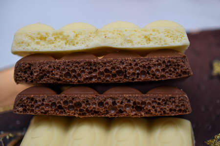 porous chocolate, white and milkの写真素材
