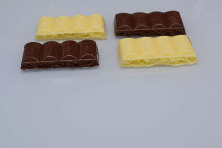porous chocolate, white and milkの写真素材