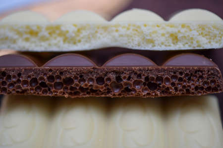 porous chocolate, white and milkの写真素材