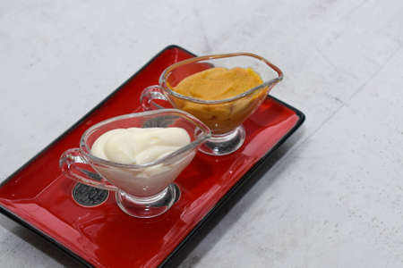 sauce pot with sauce - mustard, mayonnaise, adjika, ketchupの写真素材