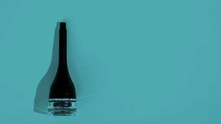 women's cosmetics with plant leaves on a blue or turquoise backgroundの写真素材