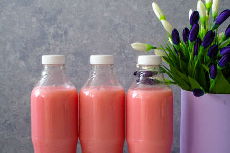 drink - strawberry juice with milk in a plastic bottleの写真素材