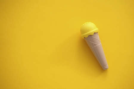 toy ice cream of different colors on a colored background