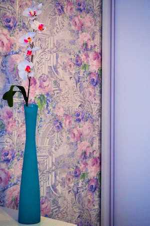 white orchid in a vase on a dark backgroundの写真素材