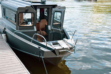 boat on the water at the pier in spring on a clear dayの写真素材