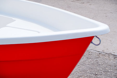 Red bathtub on the beach. Close-up of a tubの写真素材
