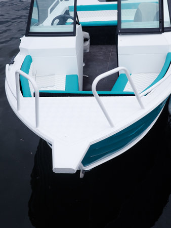 White boat on the water of the lake in a summer day.の写真素材