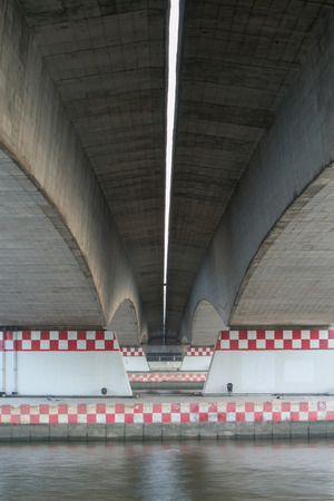 under the bridge with riverの写真素材
