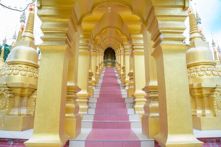 Walking into the temple stairs in thailandの写真素材