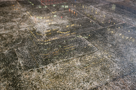 The floor wet with the light reflected from the building.の写真素材