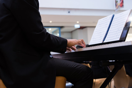 The people shown on the piano.