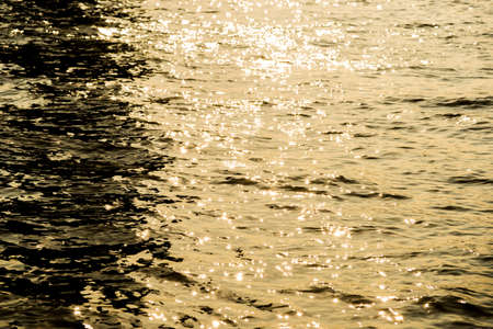 Wave impact river with the sunの写真素材