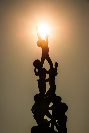 Black shadow sculptures describe the destruction.の写真素材