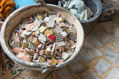 A decayed abandoned cement building mess with roof tiles only create an unorganized patternの写真素材