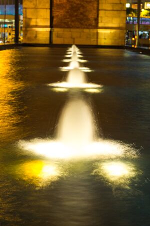 Fountain with light in the city.の写真素材