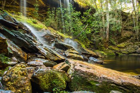 beautiful tropical rainforest waterfall in deep forest, Phu Kradueng National Park, Thailandの写真素材