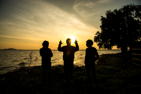 friends posing in the viewpoint Riverの写真素材