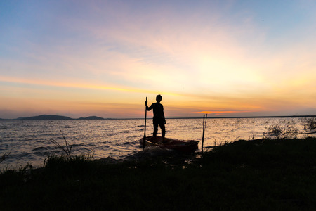 Silhouette of Canoes on the Riverの写真素材