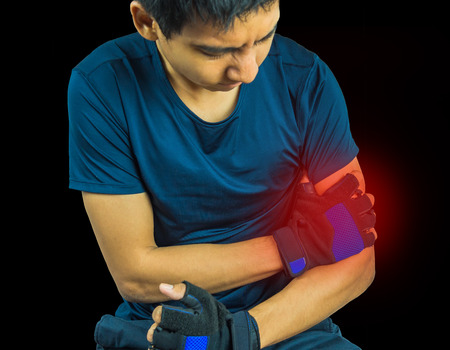 man having arm pain isolated on white backgroundの写真素材