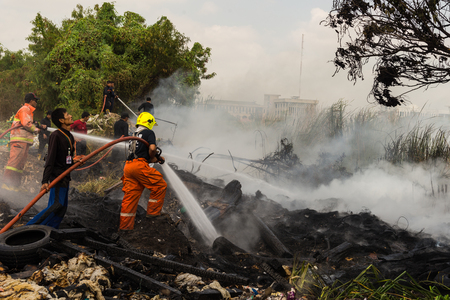 Nonthaburi, Thailand - March 11, 2017 : Firemen fighting the fire at wilderness area in Thailandのeditorial素材