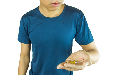 Portrait of a athletic man after doing exercises, isolated over a white backgroundの写真素材