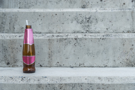 Bottle of alcohol with gray backgroundの写真素材
