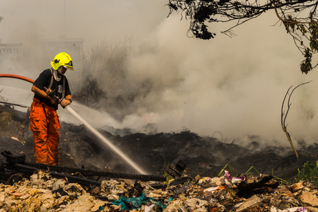 Nonthaburi, Thailand - March 11, 2017 : Firemen fighting the fire at wilderness area in Thailandのeditorial素材