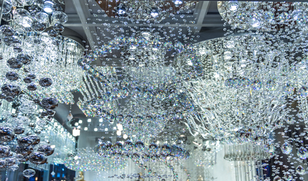 lighting balls on the chandelier in the lamplight, light bulbs hanging from the ceiling,の写真素材