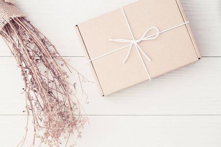 Gift boxes on the white wood,Cardboard boxes tied with string white top viewの写真素材