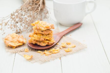crispy cereal cookie on white wooden tableの写真素材