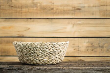 The basket on the old wood.の写真素材
