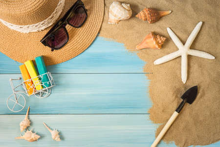 Sand and shells on the wooden floor of the blue,summer conceptの写真素材