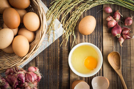 Eggs on old wooden table,top view