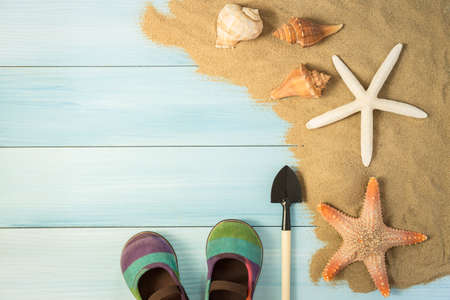 Sand and shells on the wooden floor of the blue,summer conceptの写真素材