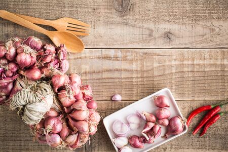 Shallots on old wooden table,Top viewの写真素材