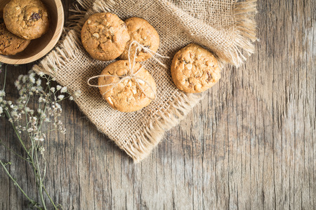 Top view and overhead shot of cookies on old wooden background,Homemade cookies on sackclothの写真素材