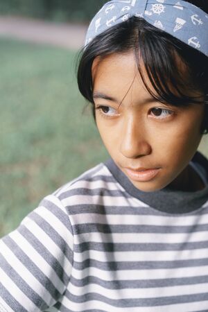 Close-up portrait of Asian  little girl a pose in the park
