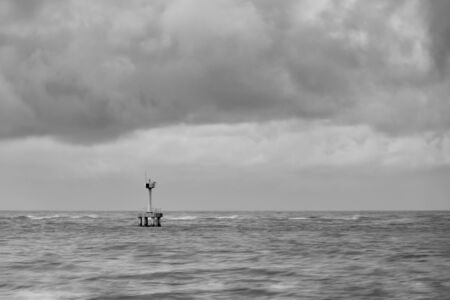 lighthouse with black clouds in the rainy dayの写真素材