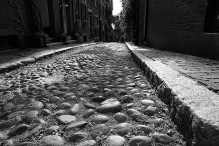 child's eye view of one of the original cobblestone streets in america, Acorn Street in Beacon Hill in Bostonの写真素材
